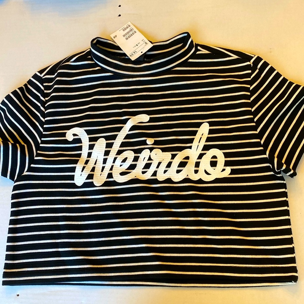 H&M NWT Cropped Top. Black and white striped.  “Weirdo” lettering on the front